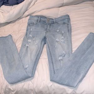 Light blue skinned ripped jeans, fairly new.